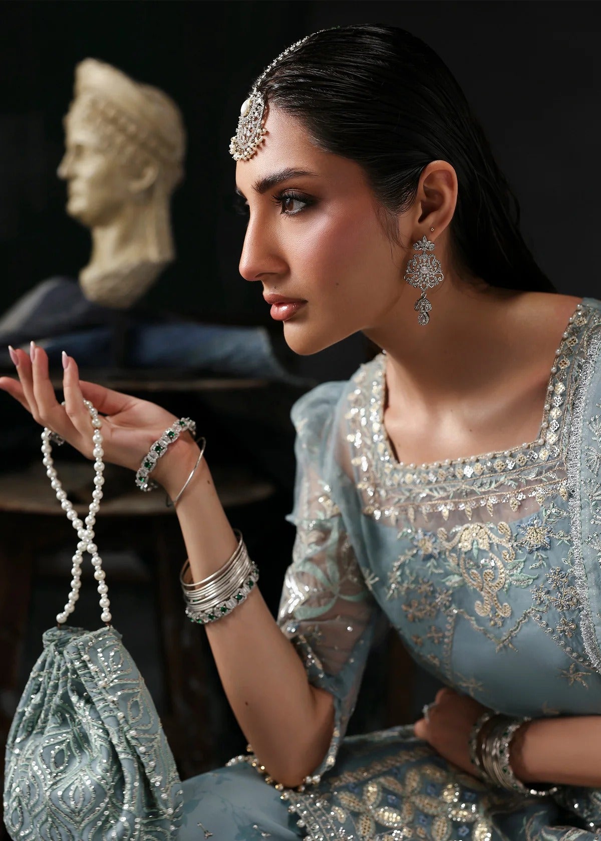 Chic ice blue organza dress with embroidered panels, dupatta & raw silk trouser. Available stitched/unstitch with custom sizing & worldwide delivery.