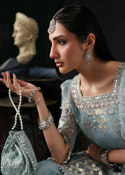Chic ice blue organza dress with embroidered panels, dupatta & raw silk trouser. Available stitched/unstitch with custom sizing & worldwide delivery.