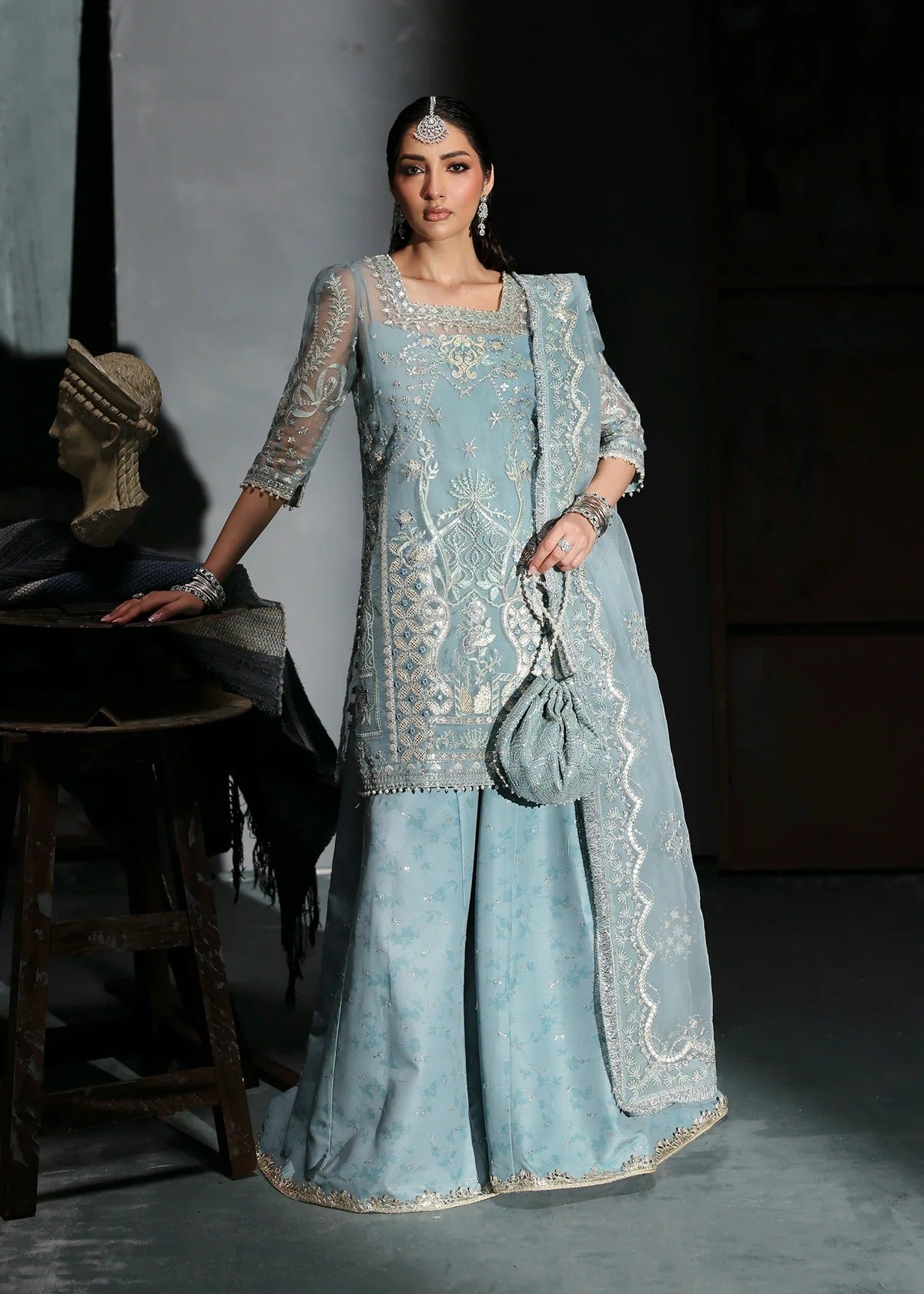 Chic ice blue organza dress with embroidered panels, dupatta & raw silk trouser. Available stitched/unstitch with custom sizing & worldwide delivery.