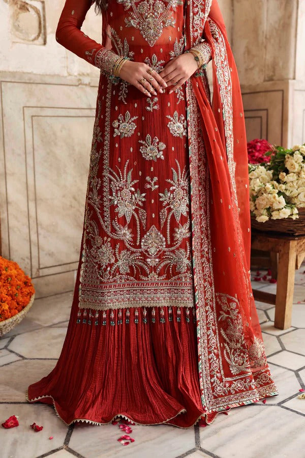 Elegant organza formal dress with detailed embroidery and hand embellishment, paired with raw silk trouser for a refined festive look.