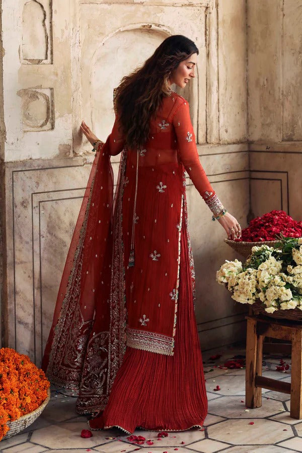 Elegant organza formal dress with detailed embroidery and hand embellishment, paired with raw silk trouser for a refined festive look.