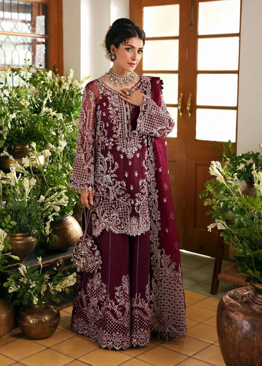 Regal imperial plum suit with hand-embellished organza panels, ornate borders, embroidered dupatta, and trouser for timeless festive elegance.