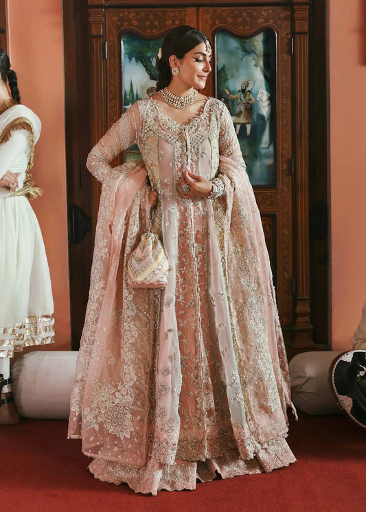 Stunning jewel-toned lehenga suit with hand-embellished shirt, embroidered borders, and organza dupatta for a regal festive look.