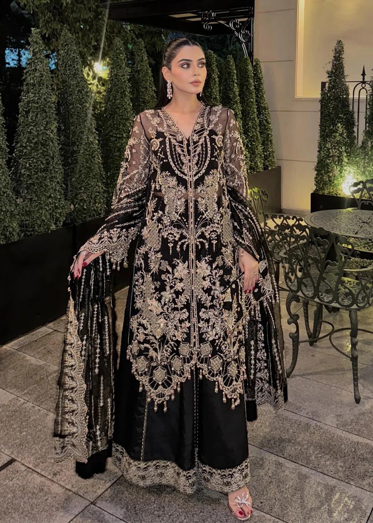 Majestic onyx noir suit with hand-embellished organza panels, refined borders, embroidered dupatta, and sleek trouser for timeless evening elegance.
