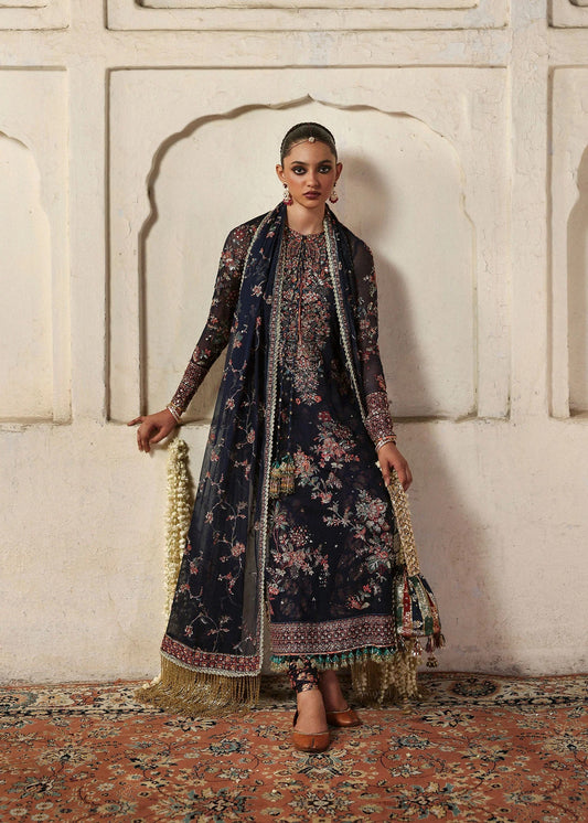 Elegant navy blue chiffon shirt with rich embroidery, silk churidar, and chiffon dupatta. Unstitched festive outfit blending modern grace and timeless charm.