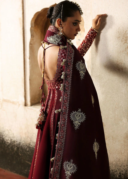 Elegant burgundy and maroon Korean raw silk pishwas with rich embroidery and matching churidar. Unstitched luxury outfit for timeless royal grace.