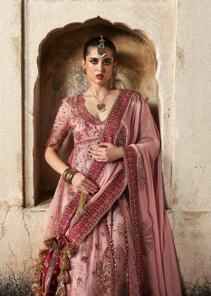 Chic rose pink organza pishwas with embroidered panels, silk lehnga, and chiffon dupatta. Unstitched festive outfit blending elegance with modern charm.
