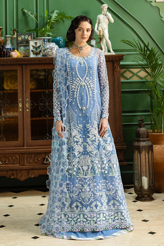 Stunning blue ensemble with embroidered net shirt, sequined dupatta, raw silk trouser, and handmade tassels for a graceful festive look.
