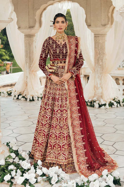 Opulent velvet and raw silk suit with embellished panels, rich embroidered borders, and a chiffon dupatta — perfect for festive elegance.