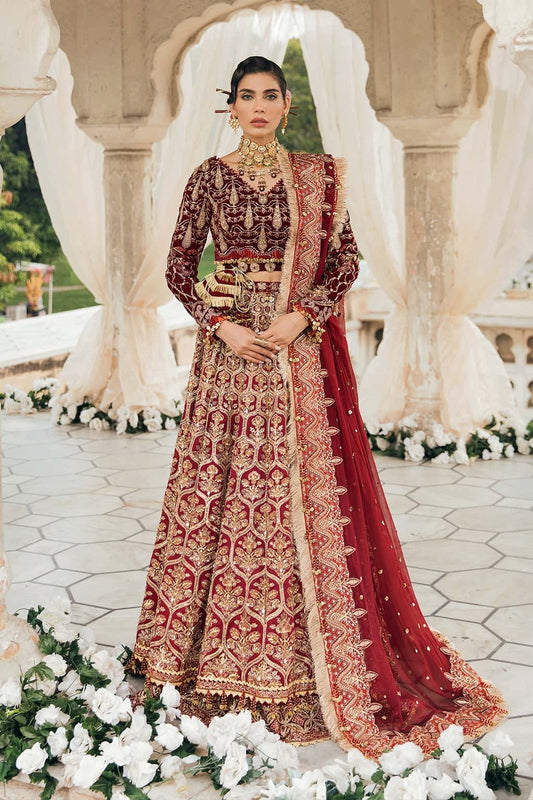 Opulent velvet and raw silk suit with embellished panels, rich embroidered borders, and a chiffon dupatta — perfect for festive elegance.
