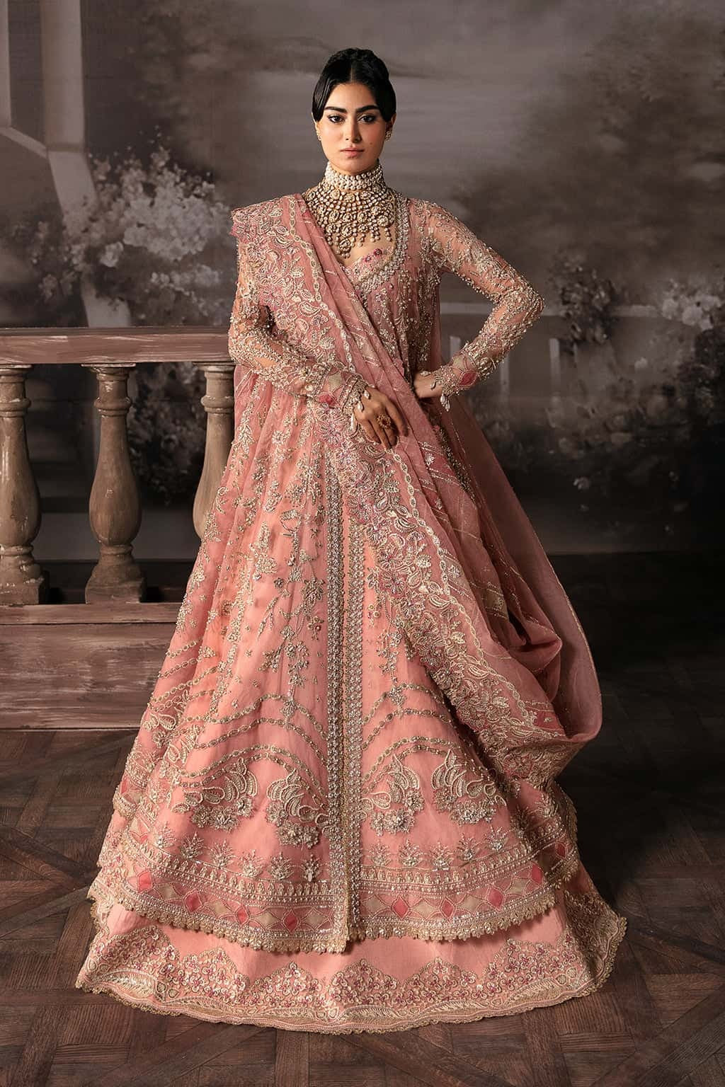Luxurious organza suit with hand-embellished panels, embroidered dupatta, and raw silk trouser — perfect for weddings and festive wear.