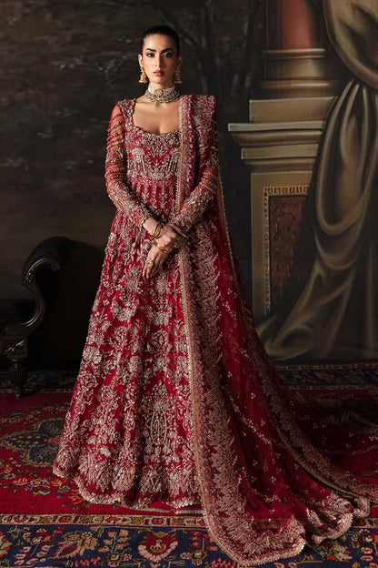 Elegant net suit featuring hand-embellished panels, organza borders, embroidered dupatta, and raw silk trouser — perfect for festive elegance.