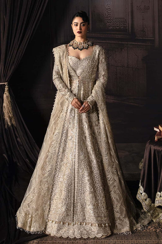 Elegant zari suit featuring hand-embellished panels, embroidered dupatta with borders, and jamavar trouser — perfect for festive and bridal wear.