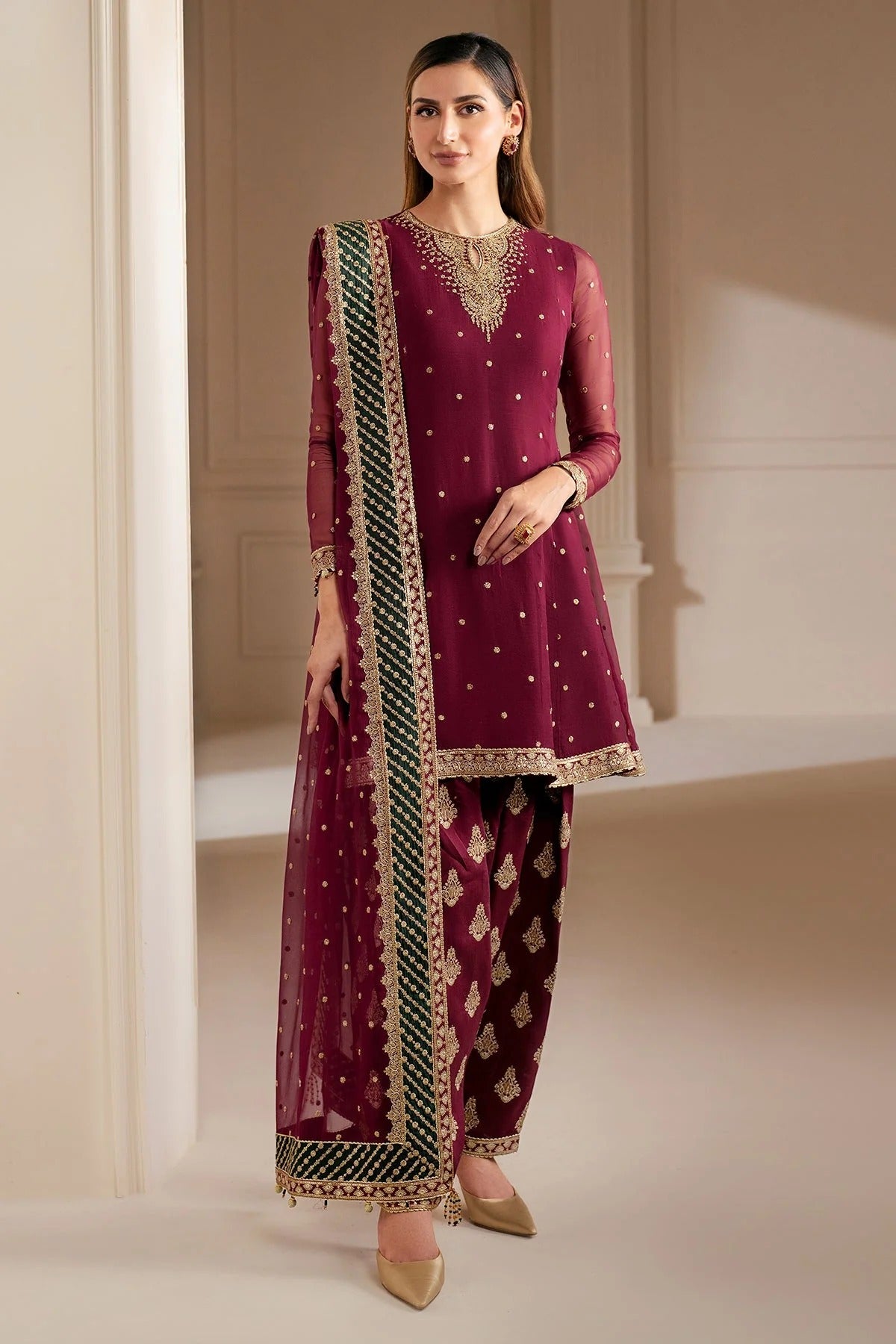 UC-3068 features delicate embroidery on chiffon panels, sleeves, and dupatta—paired with a rawsilk bottom and dyed border. Perfect for formal occasions.
