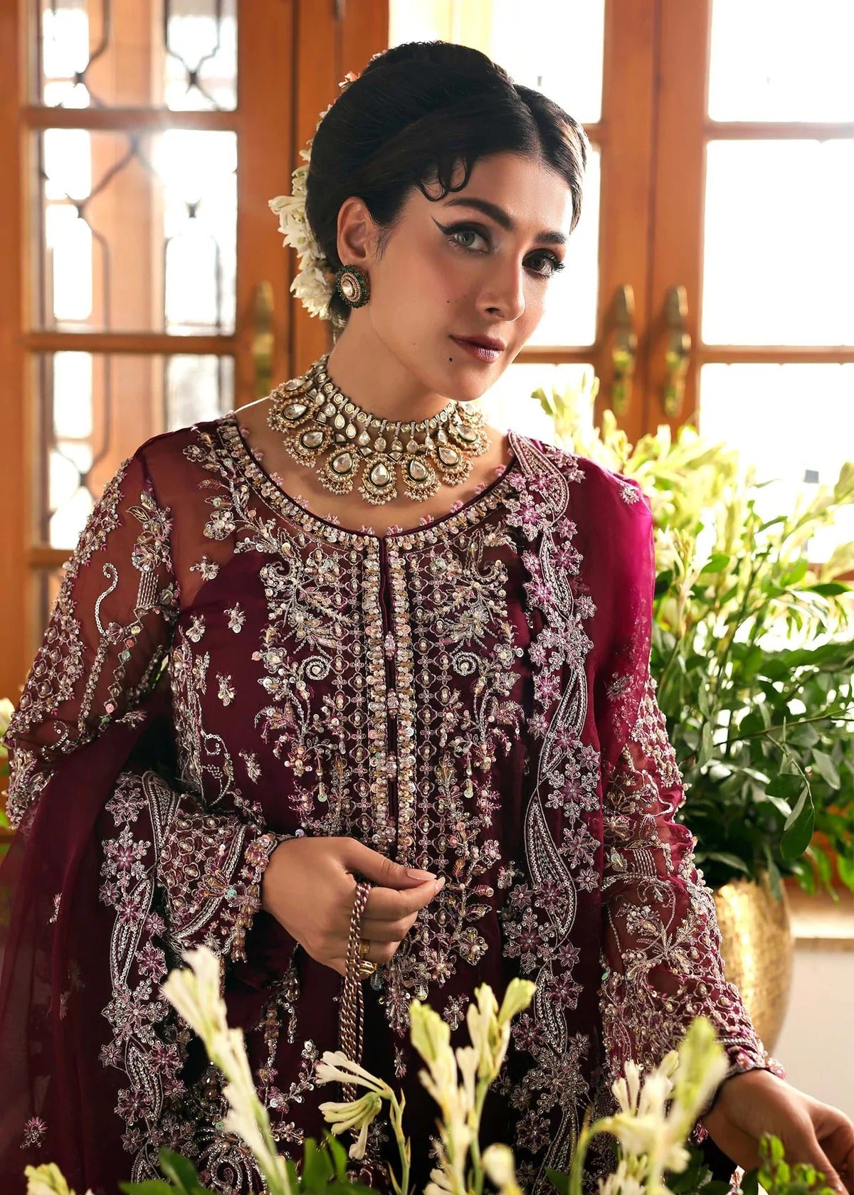 Regal imperial plum suit with hand-embellished organza panels, ornate borders, embroidered dupatta, and trouser for timeless festive elegance.