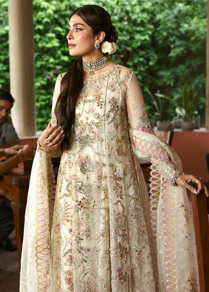 Ethereal ivory frost suit with hand-embellished organza panels, ornate borders, embroidered dupatta, and printed trouser for timeless elegance.