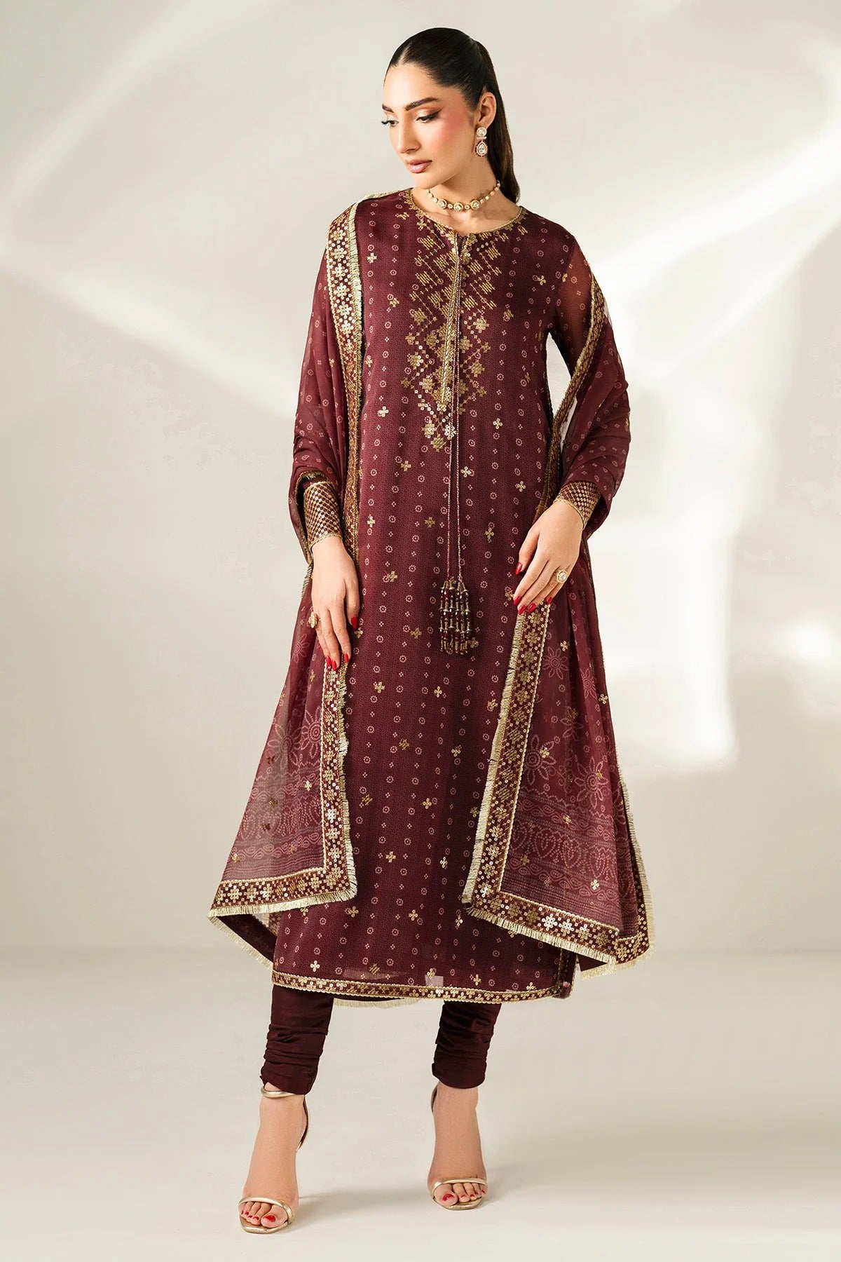 Digitally printed chiffon with intricate embroidery, bordered dupatta, and dyed raw silk bottom—perfect for weddings, festive events, or formal wear.