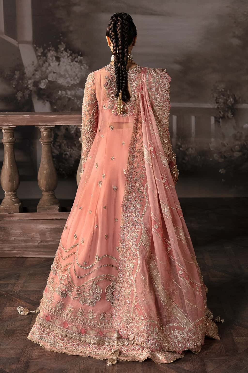 Luxurious organza suit with hand-embellished panels, embroidered dupatta, and raw silk trouser — perfect for weddings and festive wear.