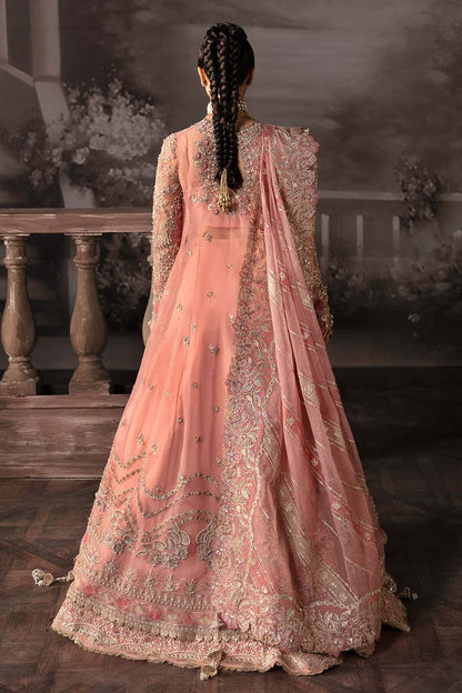 Luxurious organza suit with hand-embellished panels, embroidered dupatta, and raw silk trouser — perfect for weddings and festive wear.