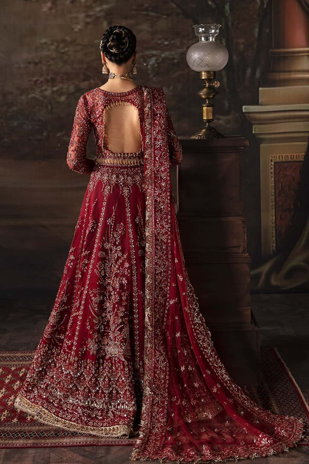 Elegant net suit with hand-embellished panels, embroidered dupatta, and waist belt border — a perfect blend of grace and festive charm.