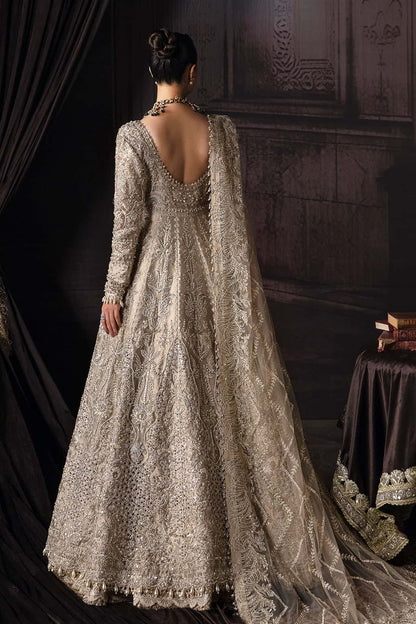 Elegant zari suit featuring hand-embellished panels, embroidered dupatta with borders, and jamavar trouser — perfect for festive and bridal wear.