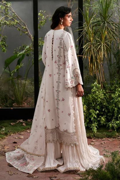 Elegant white raw silk suit featuring embroidered panels, organza borders, & a delicately embroidered dupatta with pallu  perfect for timeless festive elegance.