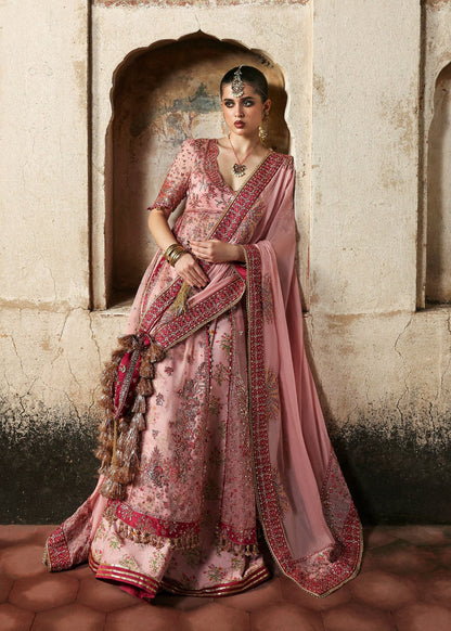 Chic rose pink organza pishwas with embroidered panels, silk lehnga, and chiffon dupatta. Unstitched festive outfit blending elegance with modern charm.