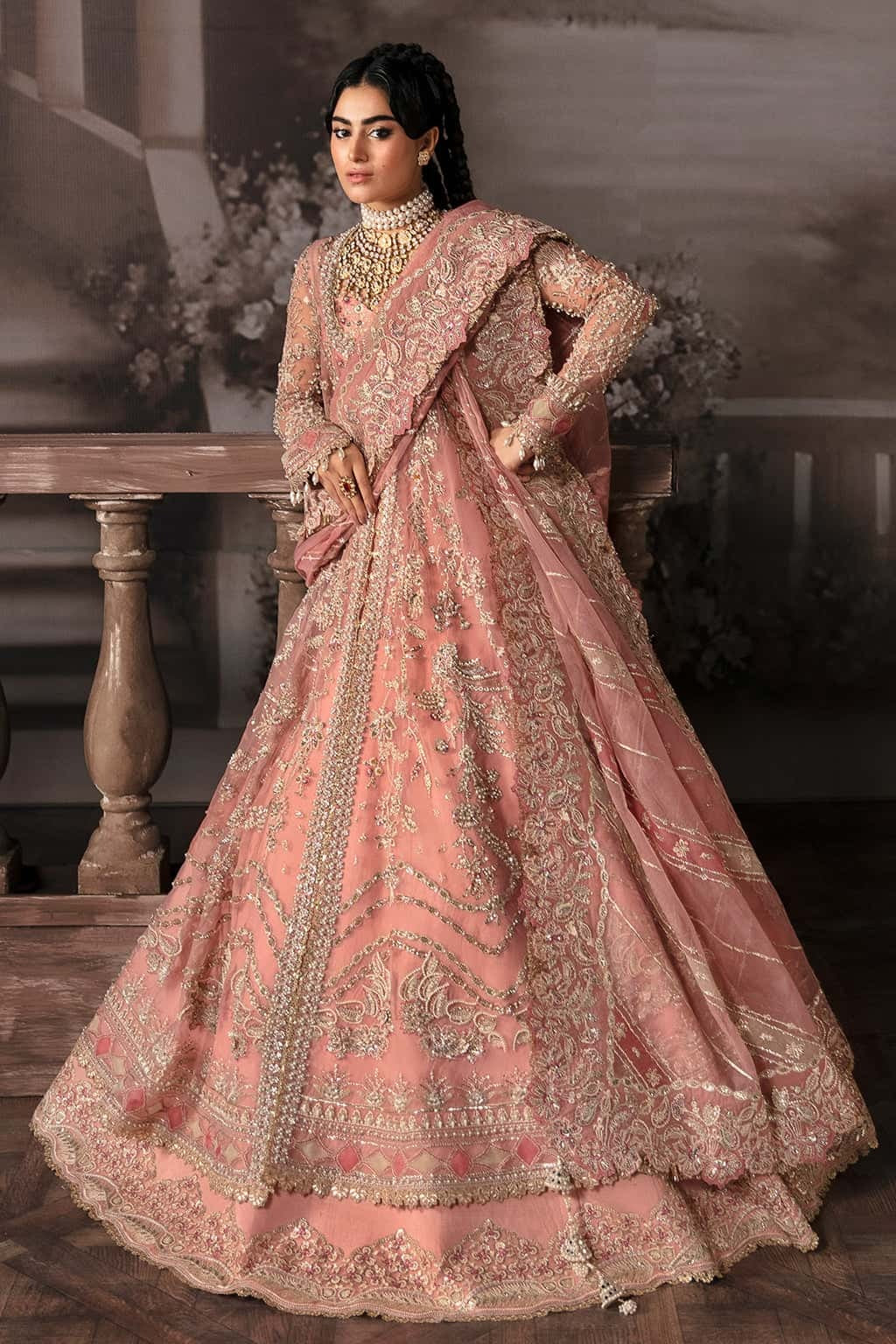 Luxurious organza suit with hand-embellished panels, embroidered dupatta, and raw silk trouser — perfect for weddings and festive wear.