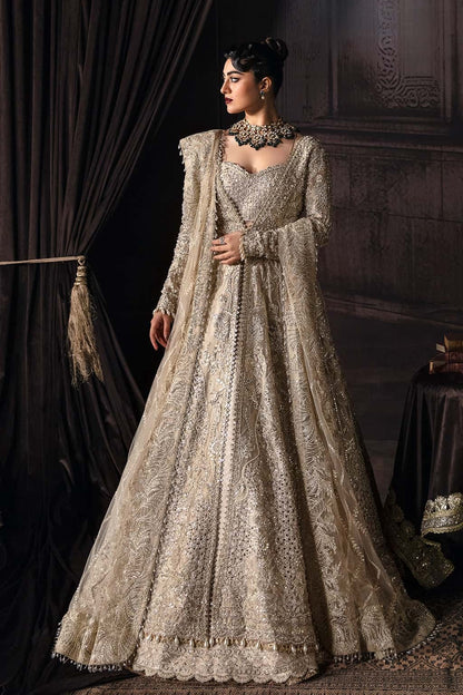 Elegant zari suit featuring hand-embellished panels, embroidered dupatta with borders, and jamavar trouser — perfect for festive and bridal wear.