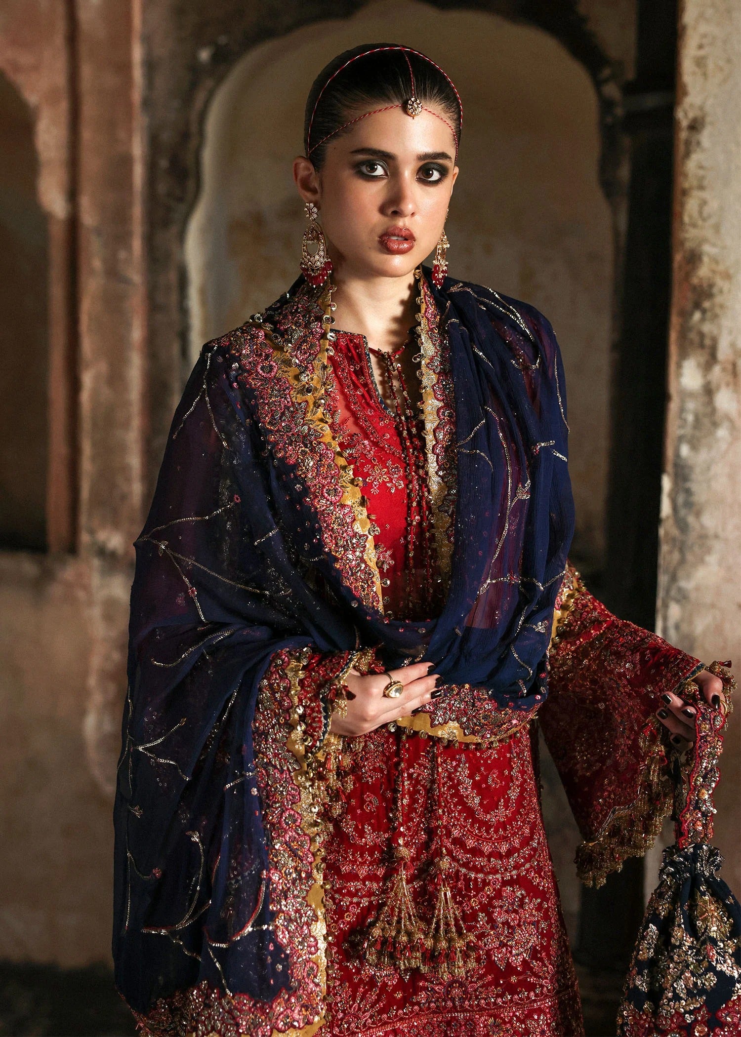 Stunning cherry red chiffon shirt with rich embroidery, silk shalwar, and chiffon dupatta. Unstitched festive outfit radiating elegance and timeless grace.