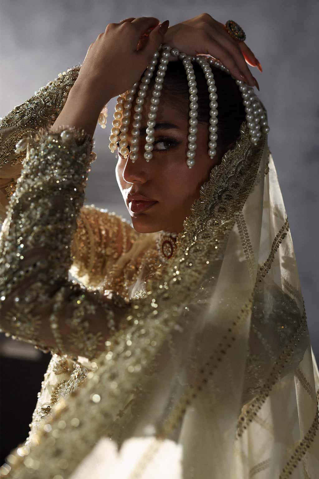 Luxurious organza suit with hand-embellished embroidery, ornate dupatta borders, and embroidered raw silk trouser — perfect for festive elegance.