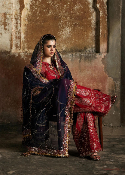 Stunning cherry red chiffon shirt with rich embroidery, silk shalwar, and chiffon dupatta. Unstitched festive outfit radiating elegance and timeless grace.