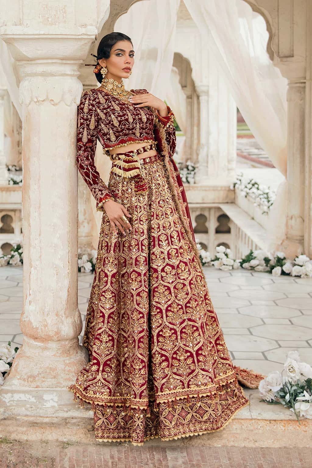 Opulent velvet and raw silk suit with embellished panels, rich embroidered borders, and a chiffon dupatta — perfect for festive elegance.