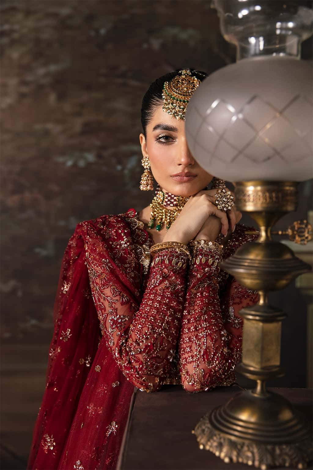 Elegant net suit with hand-embellished panels, embroidered dupatta, and waist belt border — a perfect blend of grace and festive charm.
