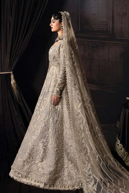Elegant zari suit featuring hand-embellished panels, embroidered dupatta with borders, and jamavar trouser — perfect for festive and bridal wear.