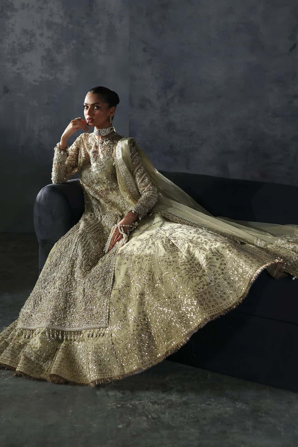 Luxurious organza suit with hand-embellished embroidery, ornate dupatta borders, and embroidered raw silk trouser — perfect for festive elegance.