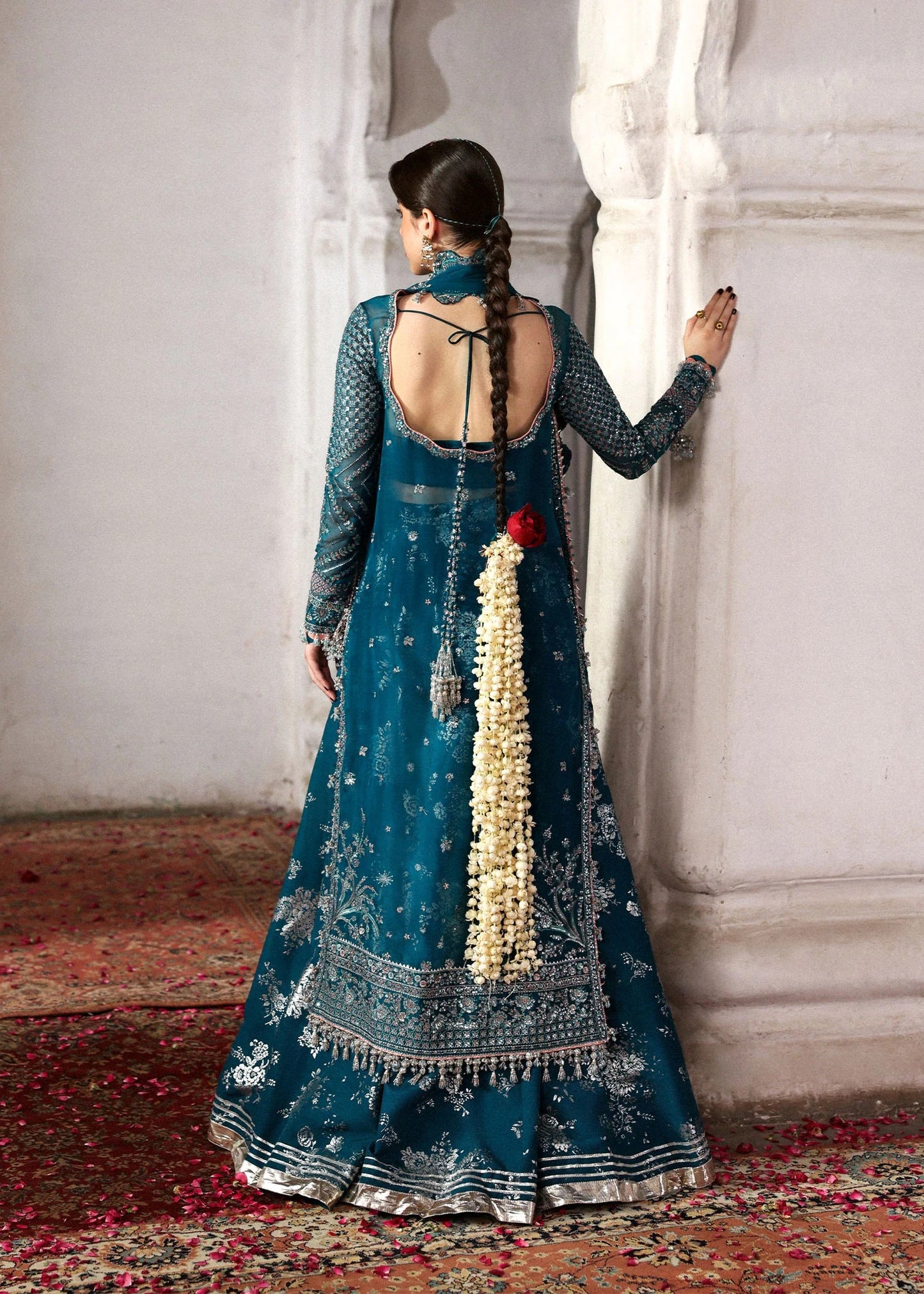 Graceful teal organza shirt with fine embroidery, silk sharara, and chiffon dupatta. Unstitched festive outfit perfect for elegant traditional occasions.
