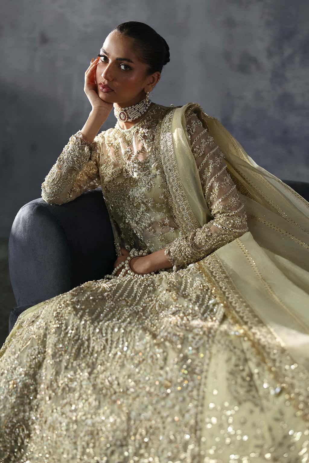 Luxurious organza suit with hand-embellished embroidery, ornate dupatta borders, and embroidered raw silk trouser — perfect for festive elegance.