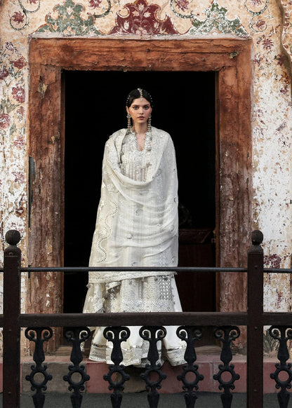 Elegant ivory organza shirt with sequin embroidery, silk sharara, and chiffon dupatta. Unstitched luxury outfit exuding timeless grace and sophistication.