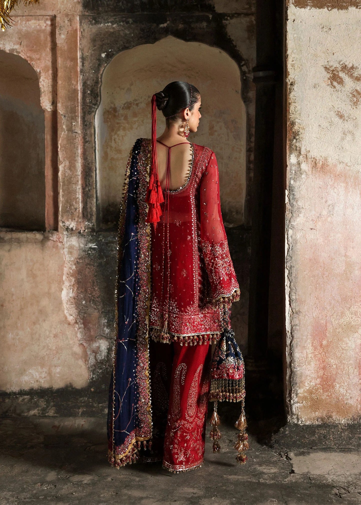 Stunning cherry red chiffon shirt with rich embroidery, silk shalwar, and chiffon dupatta. Unstitched festive outfit radiating elegance and timeless grace.