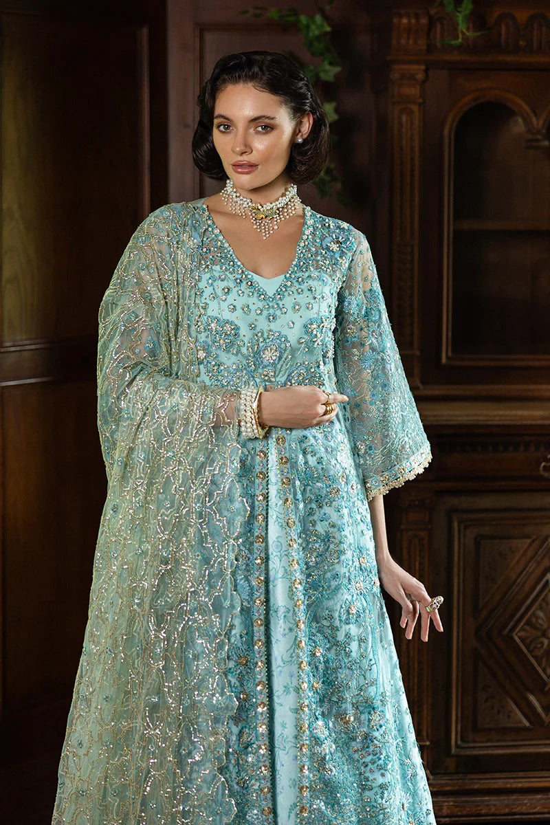 Elegant aqua blue dress with embroidered net shirt, sequined dupatta, printed lehenga, golden samosa lace, and delicate hand embellishments.