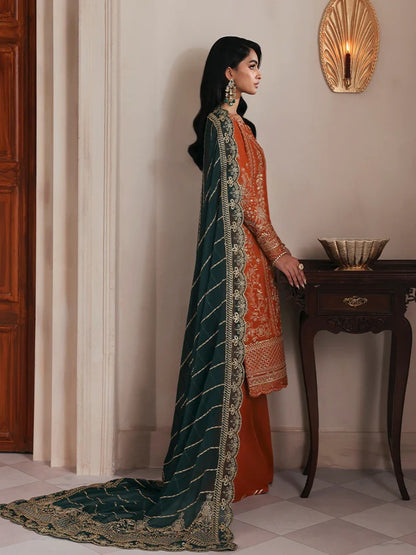 Grace your wardrobe with this embroidered and sequined raw silk outfit featuring detailed panels, chiffon dupatta with organza border, and dyed silk trousers.