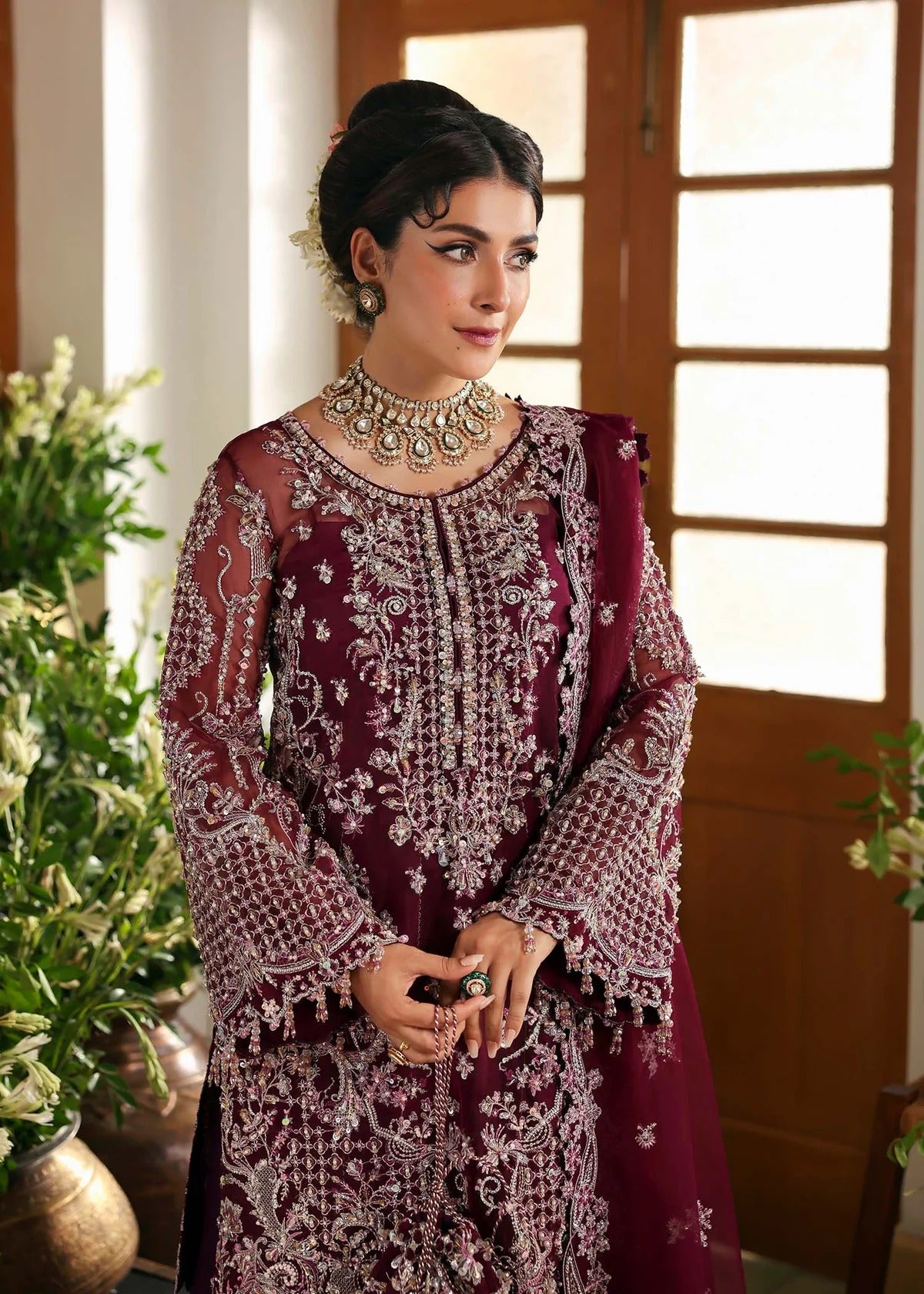 Regal imperial plum suit with hand-embellished organza panels, ornate borders, embroidered dupatta, and trouser for timeless festive elegance.