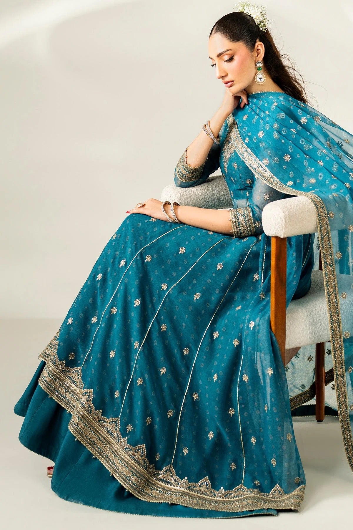Digitally printed chiffon suit with embroidery on yoke, panels, sleeves & dupatta. Paired with dyed rawsilk bottom for a luxe, elegant formal look.