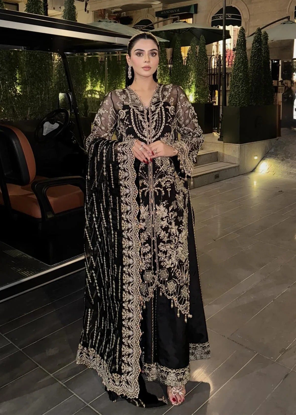 Majestic onyx noir suit with hand-embellished organza panels, refined borders, embroidered dupatta, and sleek trouser for timeless evening elegance.