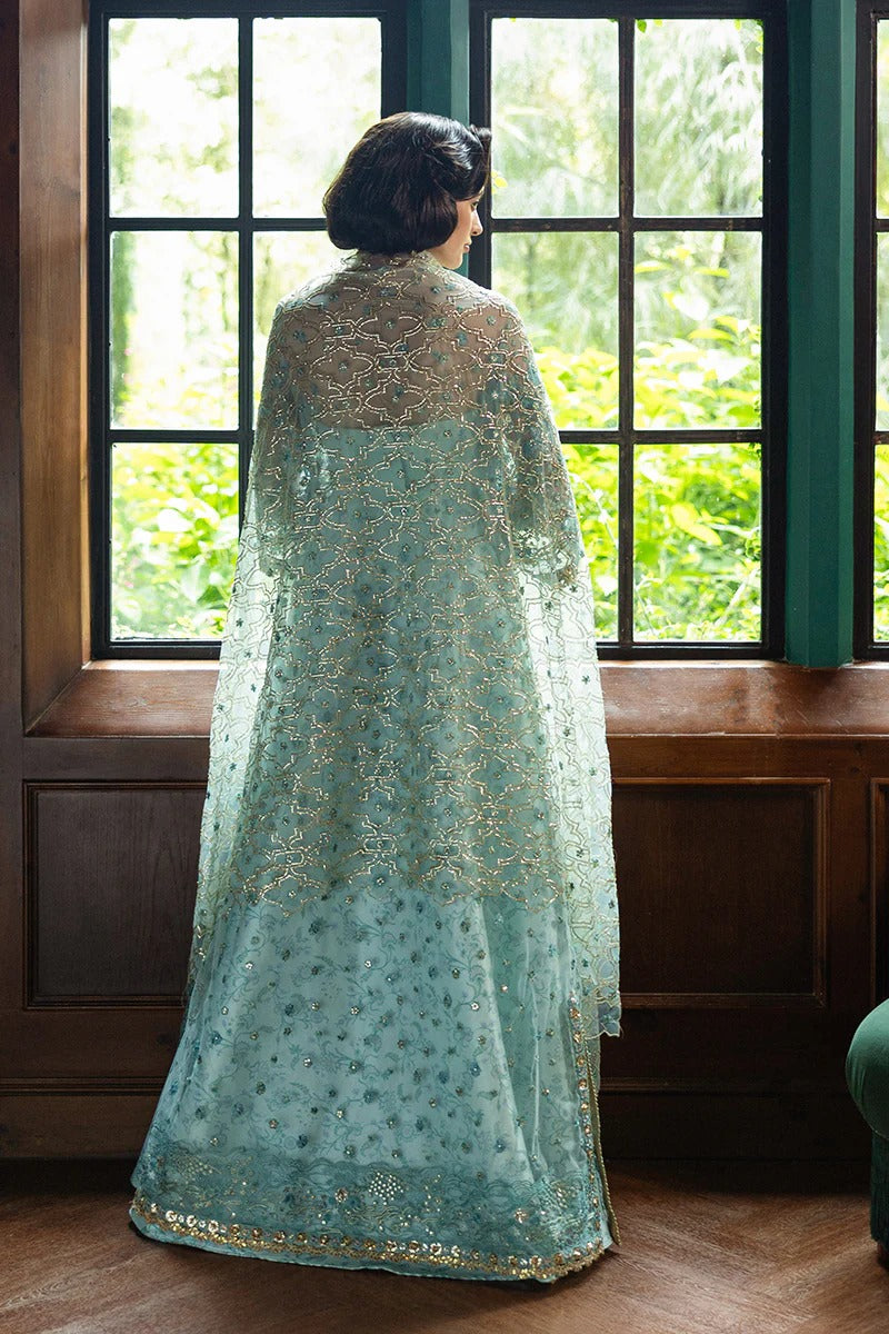 Elegant aqua blue dress with embroidered net shirt, sequined dupatta, printed lehenga, golden samosa lace, and delicate hand embellishments.