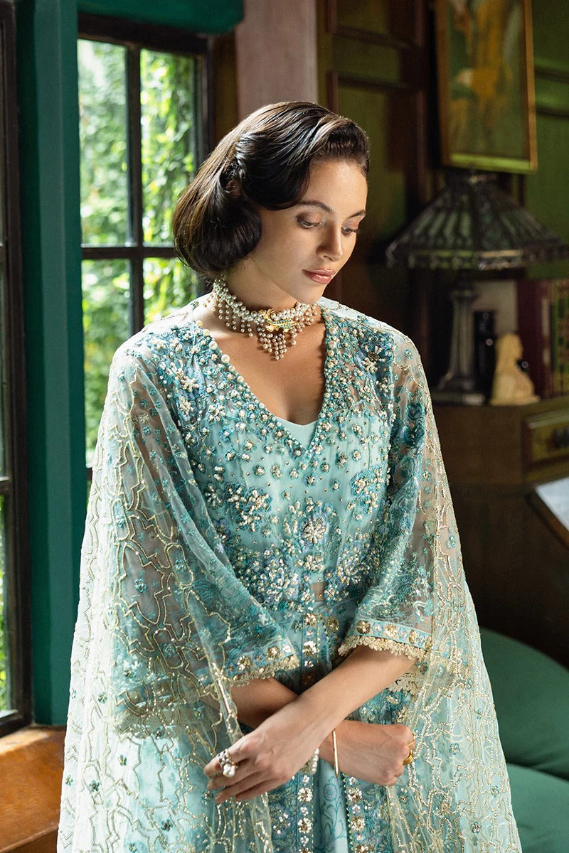 Elegant aqua blue dress with embroidered net shirt, sequined dupatta, printed lehenga, golden samosa lace, and delicate hand embellishments.