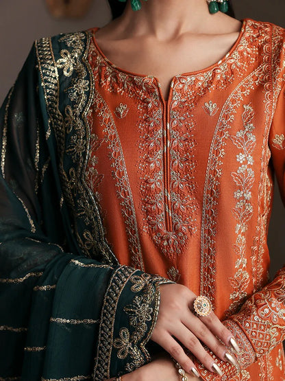 Grace your wardrobe with this embroidered and sequined raw silk outfit featuring detailed panels, chiffon dupatta with organza border, and dyed silk trousers.