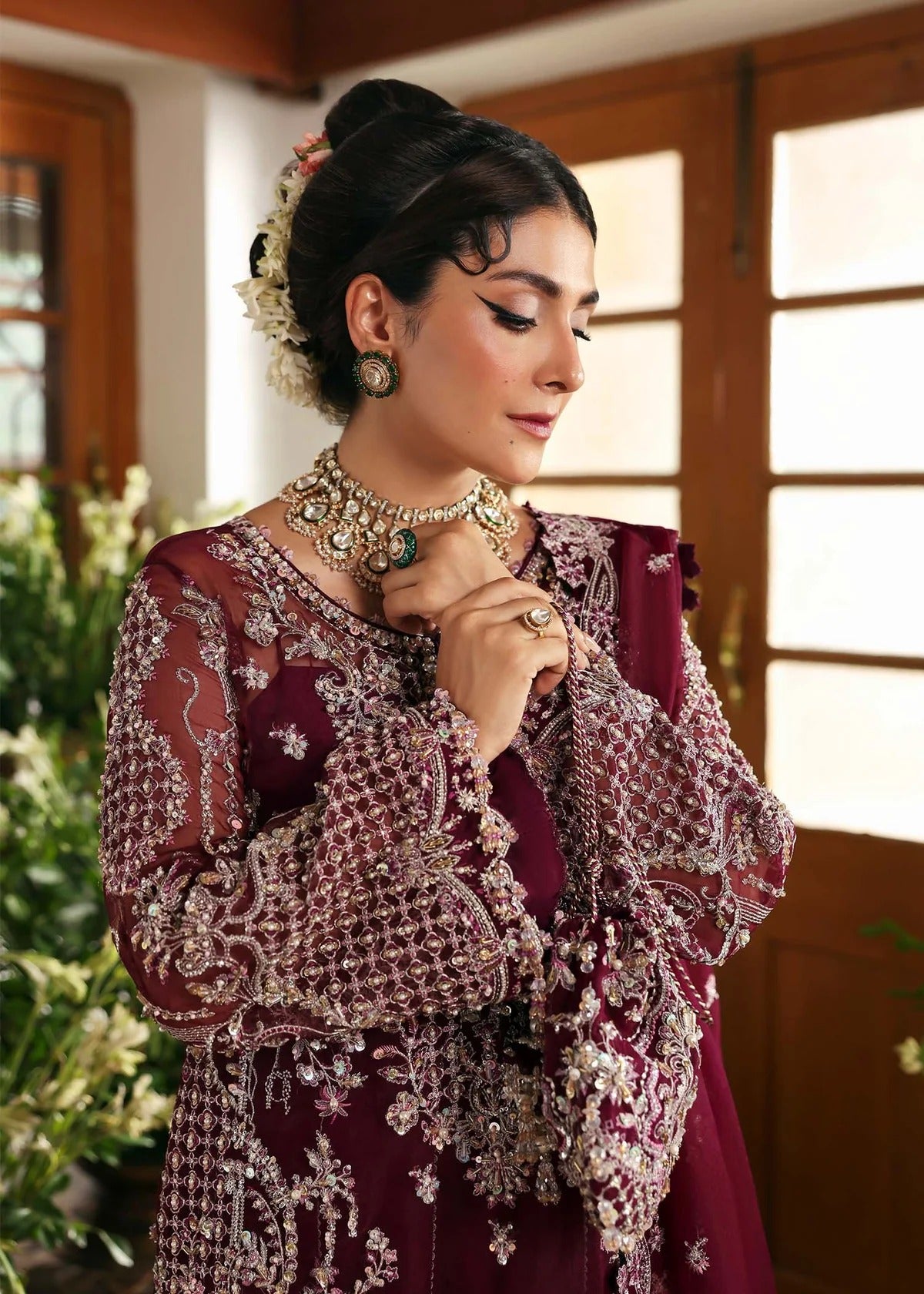 Regal imperial plum suit with hand-embellished organza panels, ornate borders, embroidered dupatta, and trouser for timeless festive elegance.
