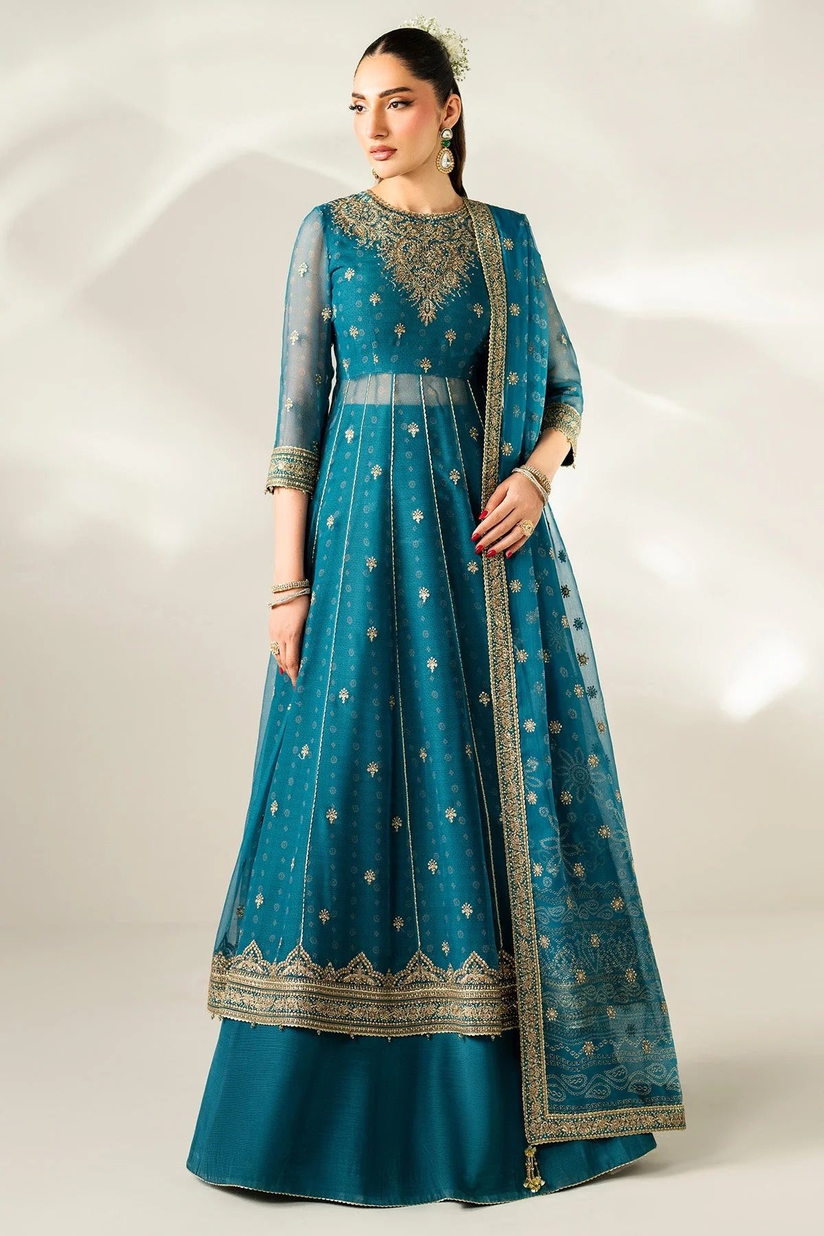 Digitally printed chiffon suit with embroidery on yoke, panels, sleeves & dupatta. Paired with dyed rawsilk bottom for a luxe, elegant formal look.